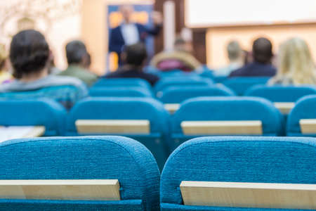 Business Meetings Concepts. Male Presenter Holding a Conference In Front of a Group of Listeneres. Horizontal Imageの写真素材
