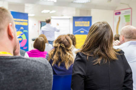 Business Meetings. People Visiting a Conference. Group of Listeneres on a Conference Watching The...
