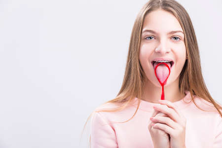Dental Health Concepts. Closeup Portrait of Caucasian Teenage Girl with Correcting Teeth Brackets....