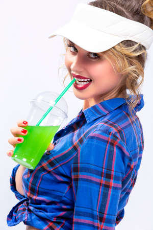 Youth Ideas and Concepts.Closeup of Enticing Caucasian Female in Checked Shirt Drinking Green...