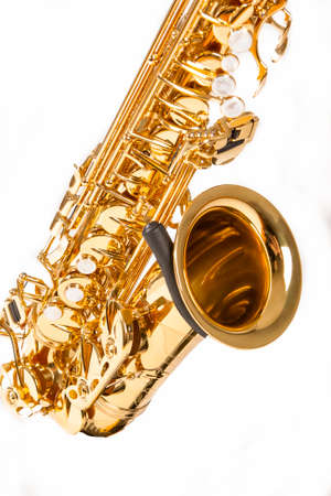 Musical Instruments Concepts. Partial View of Alto Saxophone Isolated Over White Background. Vertical Image Orientationの写真素材