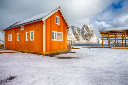 Yellow Traditional Rorbu House in Sakrisoy Fishing Village in Winter at Lofoten Islands in Wonderful Norway.Horizontal Shotの写真素材