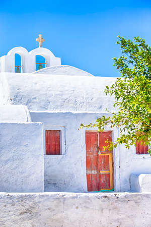 Traditional White houses of Santorini Island in Greece. Vertical Image Compositionの写真素材