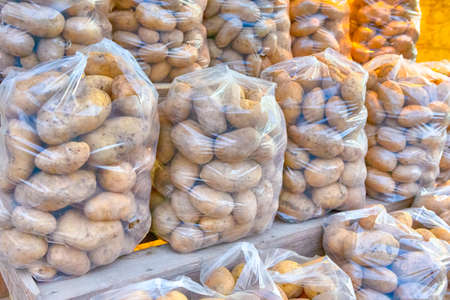 Packs of Fresh Potatoe on Display for Sale.Horizontal Imageの写真素材