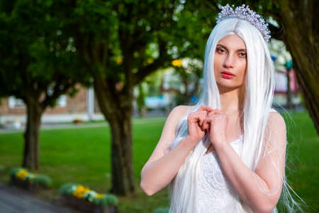 Portrait of Young Caucasian Female Bride Wearing Diadem with Long Hair. Posing Outdoors. Horizontal Imageの写真素材