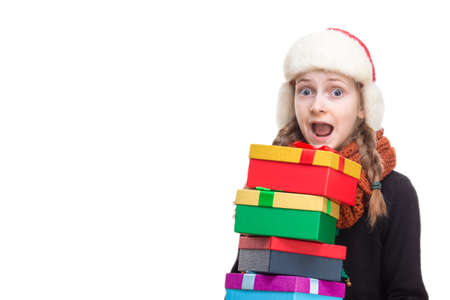 Exclaiming Caucasian Girl With Heap of Gift Boxes Posing in Winter Outfit Against Pure White in Studio. Horizontal Image Orientationの写真素材