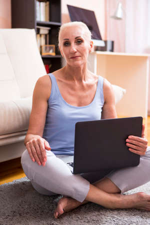 Senior Adults and Technologies Concepts. Portrait of Tranquil Positive Caucasian Female Posing With...
