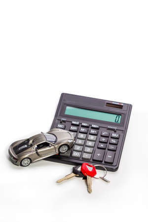 Keys Against Car and Calculator as Credit or Loans Financial Field Illustration. Horizontal Image Orientationの写真素材