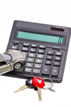 Keys Against Car and Calculator as Credit or Loans Financial Field Illustration. Vertical Imageの写真素材