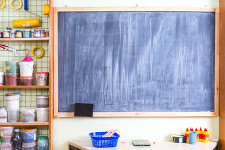 Dirty School Blackboard with Chalk Streaks in Workshoip.Horizontal Shotの写真素材