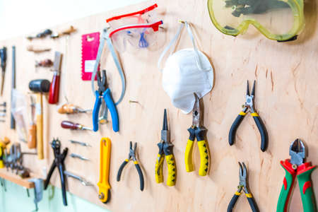Working Tools on Display in Workshop Indoors.Horizontal Image Orientation