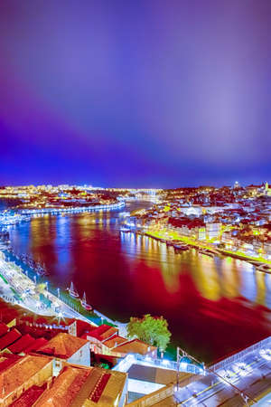 Douro River in Porto City in Portugal. Against Old City  at Blue Hour. Vertical Image Orientationの写真素材