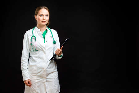 Medicine Concepts. Portrait of Professional Female GP Doctor Posing in Doctor's Smock and Endoscope. Horizontal Imageの写真素材