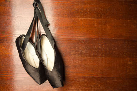 Dance Ballet Pointes Shoes on Old Vintage Background. Horizontal Image Composition