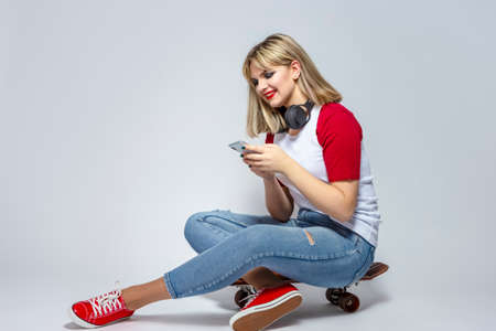 Telecommunication Issues. Portrait of Happy Chatty Caucasian Girl with Smartphone Posing in Casual...
