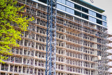Construction Site with Building Crane Against Plenty of Scaffolds.Horizontal Image
