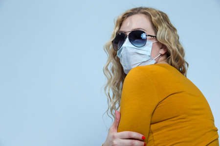 Portrait of Depressed Caucasian Woman Wearing Flu Virus Mask For Viral Prevention With Black...