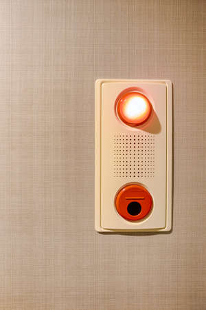 Red Alarm or Emergency Button Switch on The Wall. Vertical Image