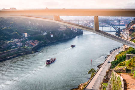 Travel Places Ideas. Line of Tourist Boats and Porto Cityscape at Daytime with Ponte Infante D...