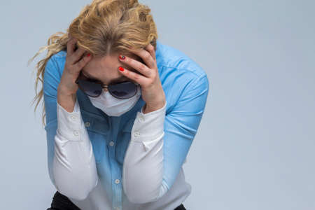 Virus Ideas. Concept of Coronavirus of Down Caucasian Woman In Glasses Touching Head with Folded...