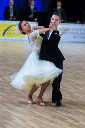 Riga, Latvia-December 15, 2019: Professional Adult Dance Couple Performs Juvenile European Standard Program on the WDSF Baltic Grand Prix-2109 Championship in December 15, 2019 in Riga, Latviaのeditorial素材