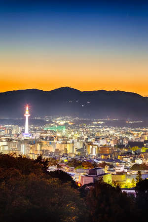 Travel Ideas. Astonishing Sunset Over Religious Kyoto City in Japan.Vertical Image Compositionの写真素材