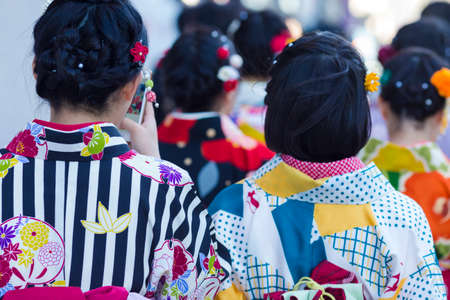 Asian Travel Destinations. Group of Female Geishas in Traditional Japanese Silk Kimono Walking on Street of Kyoto City,  Japan. Horizontal Image Compositionのeditorial素材