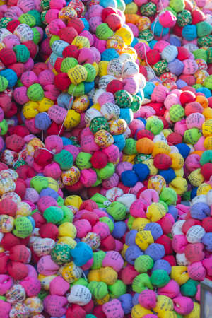 KYOTO, JAPAN - NOVEMBER, 8, 2019: Variety of Kyoto Colorful Temple Charms. Traditional Colorful Emas Formed as Colorful Squishy Balls And Made of Cloth At Kyoto Templeのeditorial素材