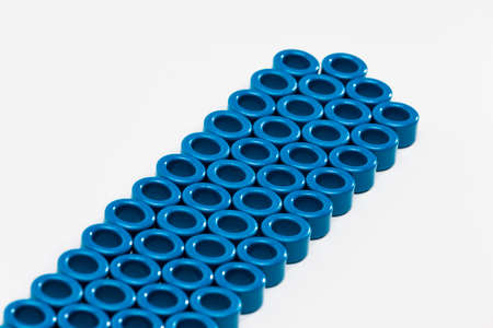 Electronic Components Concepts. Closeup of Variety of Ferrite Magnetic Cores of Blue Color. Isolated...