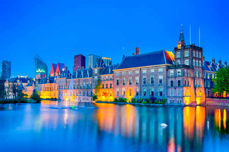 Picturesque Binnenhof Palace of Parliament inThe Hague in The Netherlands At Dusk. Against Modern Skyscrapers on Background. Horizontal Imageのeditorial素材