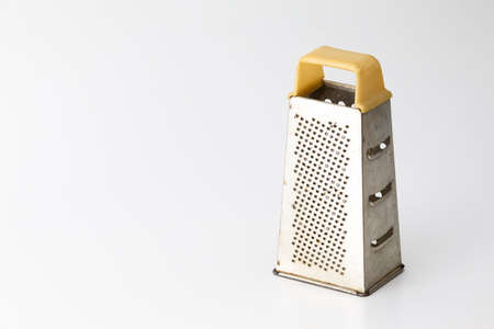 Kitchen Utensils. Old and Rusty Used Grater Made of Stainless Steel Isolated Over Pure White Background. Horizontal Imageの写真素材