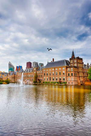 Binnenhof Palace of Parliament inThe Hague in The Netherlands At Daytime. Against Modern Skyscrapers on Background. Vertical Image Orientationのeditorial素材