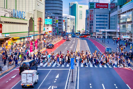 Tokyo, Japan - 9 November, 2019: Central Part of Tokyo City With Traffic Lanes with Pedestrians and Street Hoardings in Tokyo, Japan at November 9, 2019のeditorial素材