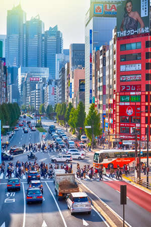 Tokyo, Japan - 9 November, 2019: Central Part of Tokyo City With Traffic Lanes with Pedestrians and Street Hoardings in Tokyo, Japan at November 9, 2019のeditorial素材