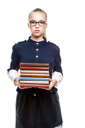 Portrait of Smiling Caucasian Teenager Girl Posing With Batch of Office Folders Against White Background. Horizontal Imageの写真素材