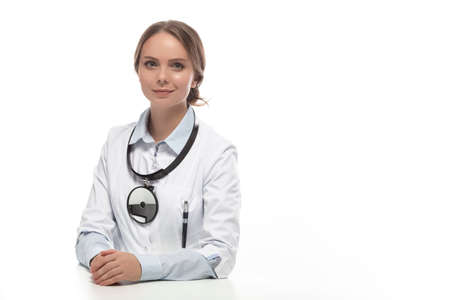 Portraif of Positive Caucasian Laboratory Female Doctor Against White. Horizontal Shotの写真素材