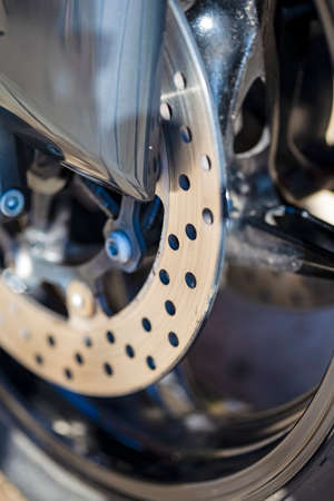 Closeup of Modern Motorcycle Front Brake Disks. Vertical Image