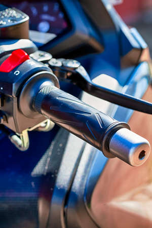 Closeup View of Acceleration Throttle Handle of Modern Motorcycle. Vertical Imageの写真素材