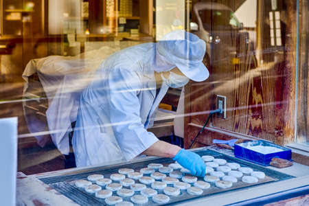 Koyasan, Japan - November, 6, 2019: Female Baker Making Traditional Japanese Dango Moti Food in Koyasan, Japanのeditorial素材