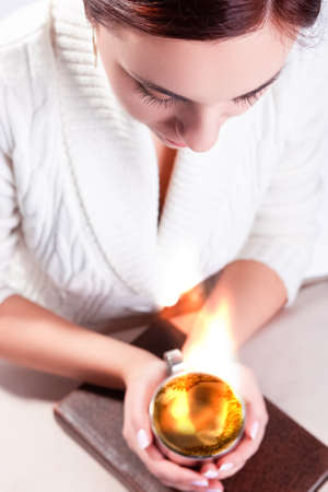 Composite Image of Relaxing and Reading Caucasian Brunette Girl Posing With Cup of Fire Drink in...