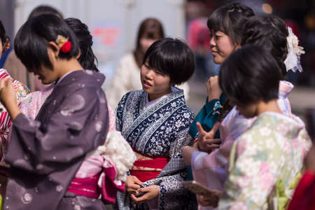 Kyoto, Japan - November 7, 2019: Group of Young Japanese People in Traditional Japanese Kimono Walking on Street of Kyoto , Japan.のeditorial素材