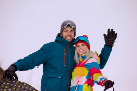Youth Winters Activities. Happy Smiling  Caucasian Couple Having Tube Activities In Winter Time...
