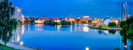 Belarus Travel Destinations. Troicky Suburb and Tears Memorial View in Minsk City During Blue Hour. Picturesque Cityscape Panoramic Imageの写真素材