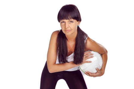 Concentrated Female Volleyball Athlete During Training Against White Background Indoors While Holding a Ball In Hands in Front.Horizontal Imageの写真素材