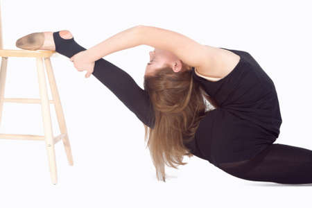 Caucasian Rhythmic Gymnast Sportswoman In Training Outfit During Backward Legs Twist Muscles...