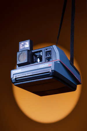 Minsk, Belarus - October 5, 2021: Closeup View of Polaroid 600 Impulse Autofocus Instant Camera Hanged Over Colorful Backgroundのeditorial素材