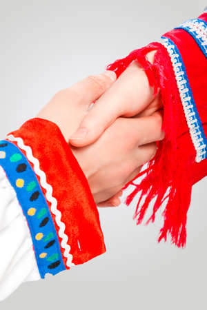 Caucasian Couple Connected Together in National Costumes Demonstrating Support and Encuragement of...