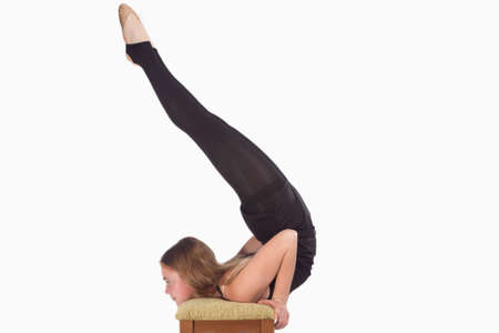 Young Caucasian Rhythmic Gymnast Sportswoman In Training Outfit During Backward Legs Twist Muscles...