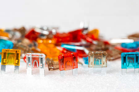 Closeup Shot of Batch of Colorful Fusable External Connectors Placed Bulk On White. Horizontal image Compositionの写真素材