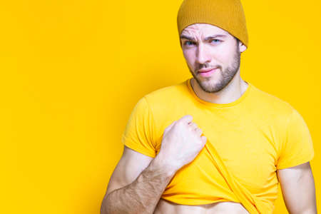 Handsome Man Posing During Improvised Photoshot As Holding A Photocamera in Hands During...